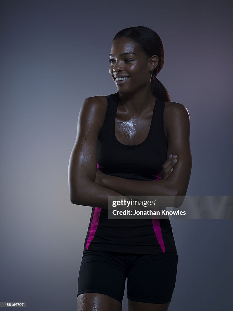 Sweaty dark skinned female post workout