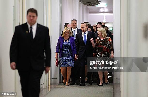 Prime Minister Tony Abbott and supporters arrive at the Liberal party room for the leadership ballot at Parliament House on September 14, 2015 in...