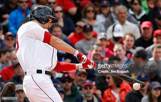 Grady Sizemore of the Boston Red Sox doubles in a run against the Oakland Athletics in the fifth inning at Fenway Park on May 4, 2014 in Boston,...