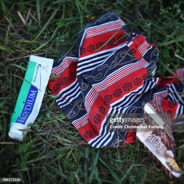 Discarded Toothpaste Toothpaste and clothing lay on the ground as migrants discard items ...