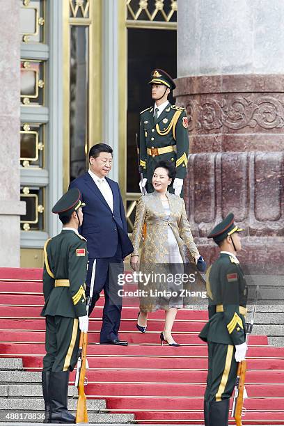 Chinese President Xi Jinping and his wife lady Peng Liyuan attends welcoming ceremony for Mauritania's President Mohamed Ould Abdel Aziz at the Great...