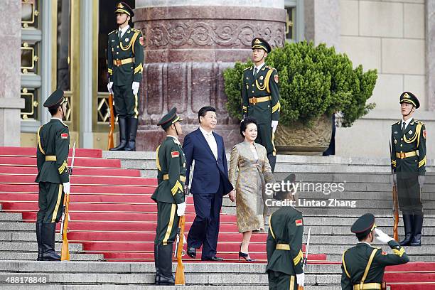 Chinese President Xi Jinping and his wife lady Peng Liyuan attends welcoming ceremony for Mauritania's President Mohamed Ould Abdel Aziz at the Great...