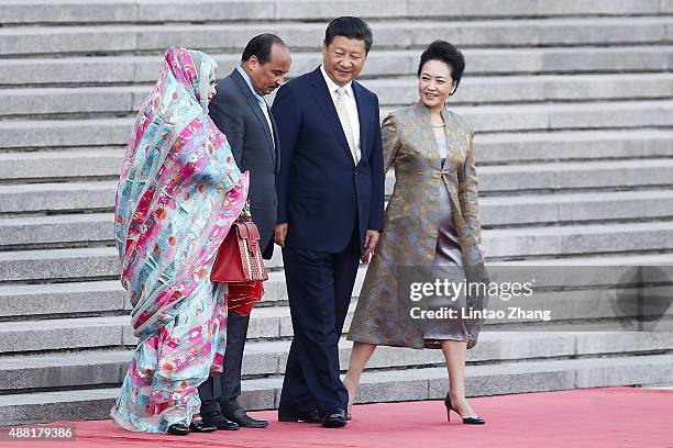 Lady Peng Liyuan, Chinese President Xi Jinping, Mauritania's President Mohamed Ould Abdel Aziz and Tekber Mint Melainine Ould Ahmed during the...