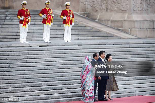 Lady Peng Liyuan, Chinese President Xi Jinping, Mauritania's President Mohamed Ould Abdel Aziz and Tekber Mint Melainine Ould Ahmed during the...