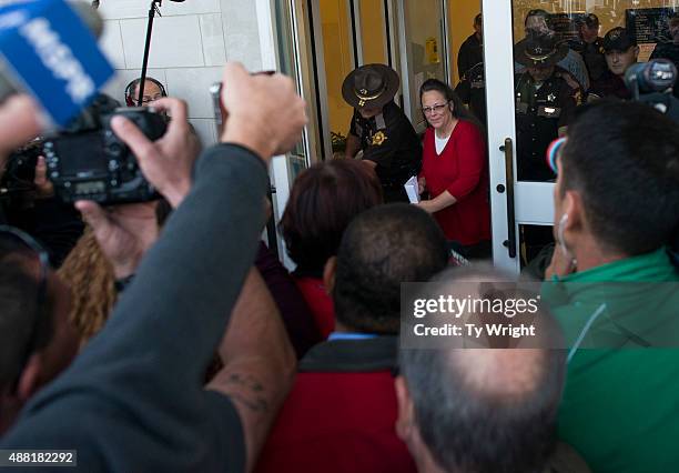 Rowan County clerk Kim Davis walks out to give a statement about her intentions on applying her signature to same sex marriage licenses on her first...