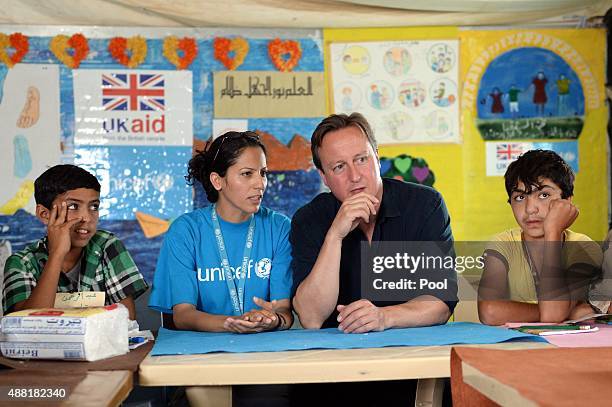 British Prime Minister David Cameron meets refugee children and teenagers at the UNICEF Makani Centre at the Za'atri refugee camp where he saw how...