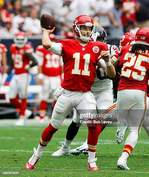 Alex Smith of the Kansas City Chiefs looks for a reeiver during the third quarter against the Houston Texans at NRG Stadium on September 13, 2015 in...