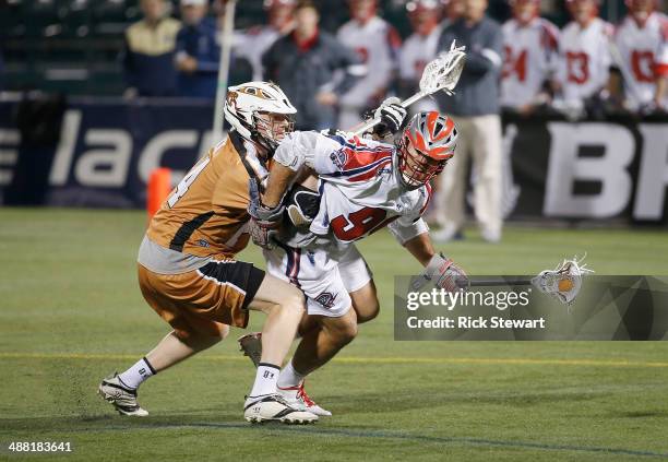 Paul Rabil of the Boston Cannons attacks against Mike Lazore of the Rochester Rattlers at Sahlen's Stadium on May 2, 2014 in Rochester, New York....