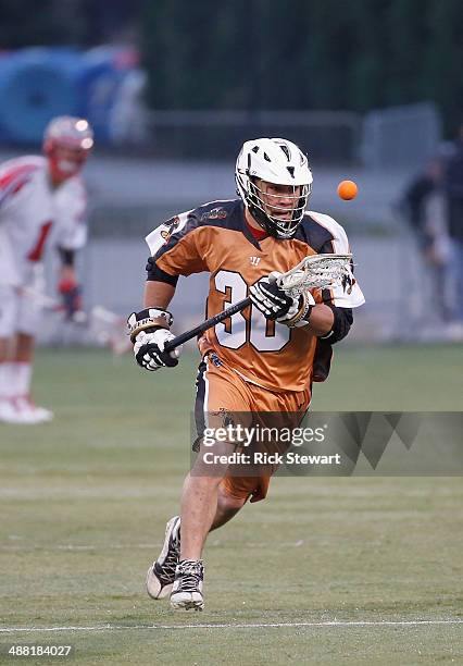 John Ortolani of the Rochester Rattlers controls the ball after a faceoff against gthe Boston Cannons at Sahlen's Stadium on May 2, 2014 in...