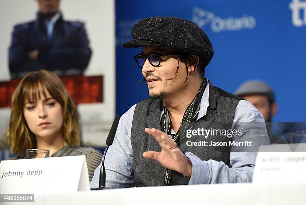 Actors Dakota Johnson and Johnny Depp attend the "Black Mass" press conference at the 2015 Toronto International Film Festival at TIFF Bell Lightbox...