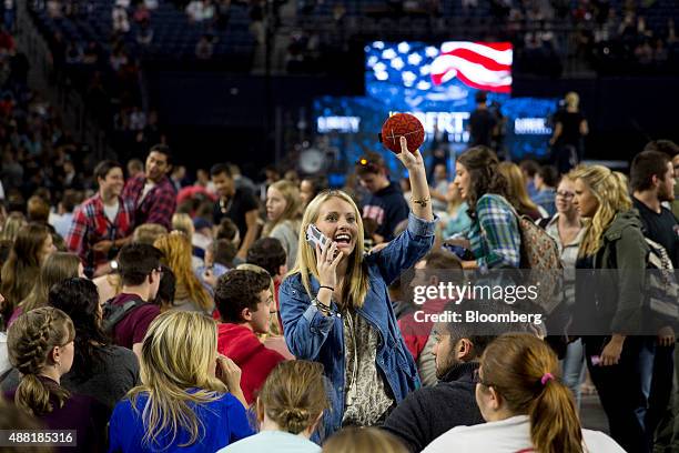 Liberty University student Allison Carnes waves to a friend before Senator Bernie Sanders, an independent from Vermont and 2016 Democratic...