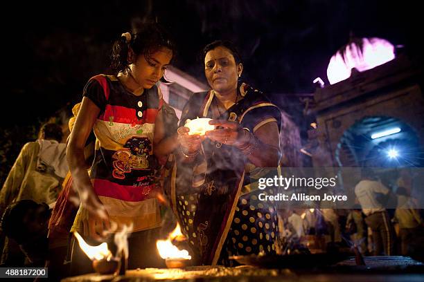 Hindu devotees gather before the second "Shahi Snan" of Kumbh Mela in the Godavari river on September 12, 2015 in Nashik, India. The Kumbh Mela, one...