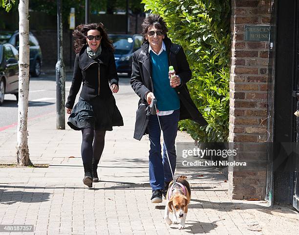 Ronnie Wood, Sally Humphreys and Mr Hudson are seen in Holland Park on May 4, 2014 in London, England.