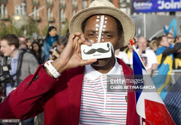 Band member of Twin Twin representing France at the Eurovision Song Contest with the song "Moustache" poses as he arrives for an opening ceremony on...