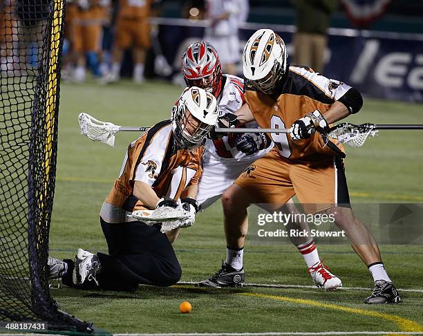 John Galloway and Matt Miller of the Rochester Rattlers defend against Ryan Boyle of the Boston Cannons at Sahlen's Stadium on May 2, 2014 in...