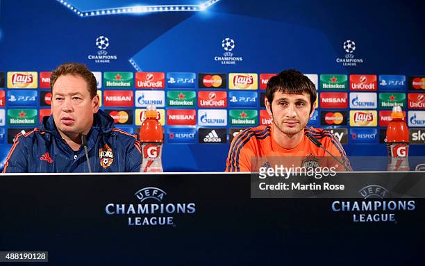 Leonid Slutski, head coach of Moscow and Alan Dzagoev attend the press conference ahead of the UEFA Champions League group B match between VfL...