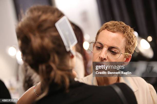 Makeup artist Romy Solemani prepares a model backstage at the Lela Rose Fashion Show during Spring 2016at The Gallery, Skylight at Clarkson Sq on...