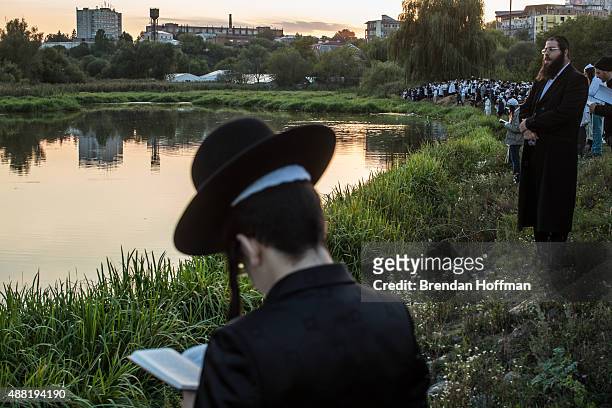 Hasidic pilgrims pray along a river, not far from the burial site of Rebbe Nachman of Breslov on September 14, 2015 in Uman, Ukraine. Every year,...
