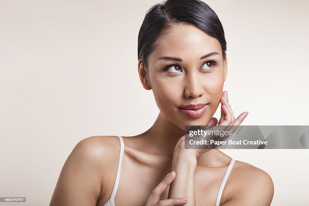 Woman resting her chin on her palm