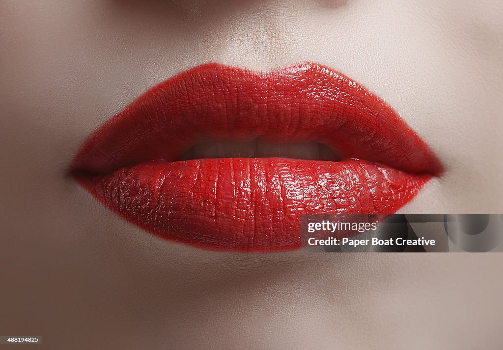 Close up of bright red shiny lips