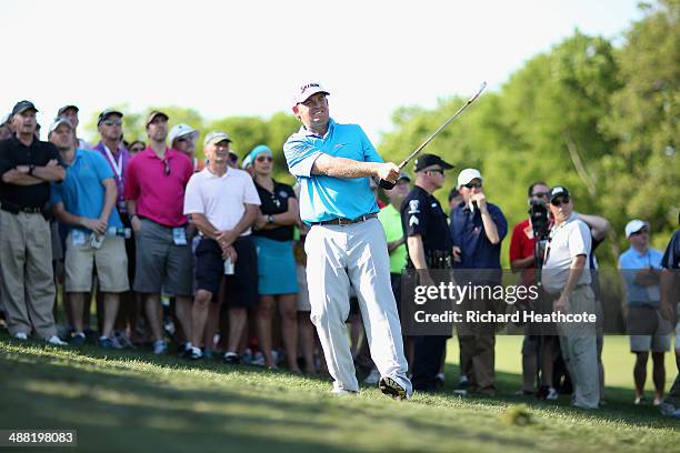 Holmes plays into the 16th green during the final round of the Wells Fargo Championship at the Quail Hollow Club on May 4, 2014 in Charlotte, North...