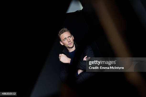 Tom Hiddleston of 'High Rise' poses for a portrait with Jeff Vespa in the Guess Portrait Studio on September 14, 2015 in Toronto, Canada.