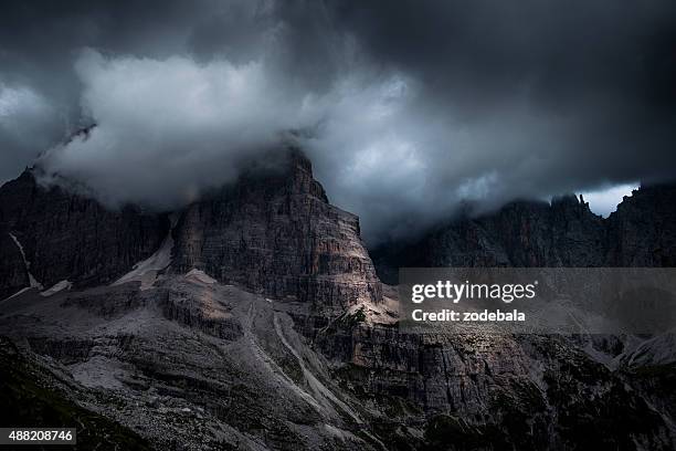 dolomites of brenta rock wall, italy - moody sky stock pictures, royalty-free photos & images