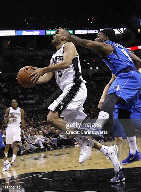 Jae Crowder of the Dallas Mavericks commits a flagrant foul on Tony Parker of the San Antonio Spurs in Game Seven of the Western Conference...