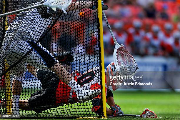 Jeremy Sieverts of the Denver Outlaws scores the game winning goal against Scott Rodgers of the Ohio Machine during the fourth quarter at Sports...