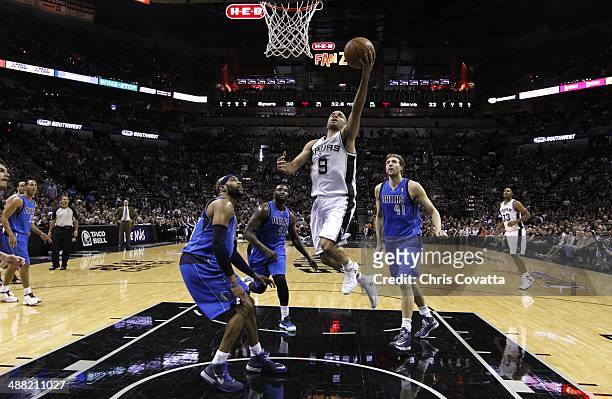 Tony Parker of the San Antonio Spurs goes to the net against the Dallas Mavericks in Game Seven of the Western Conference Quarterfinals during the...