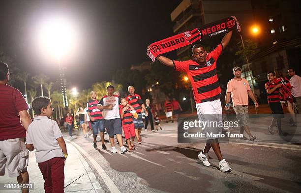 Flamengo supporter walks following a match between Flamengo and Palmeiras as part of Brasileirao Series A 2014 at Maracana Stadium on May 04, 2014 in...