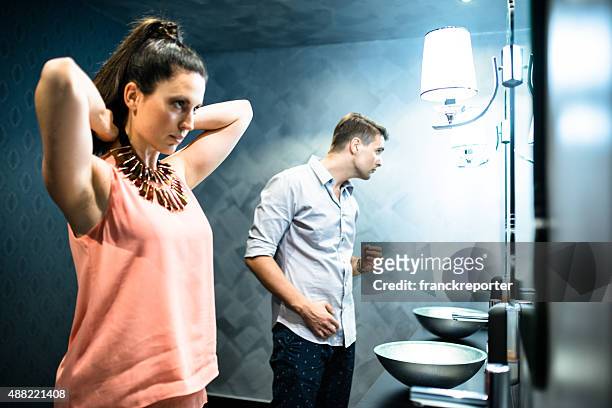 couple in front of mirror before the night out - vanity stock pictures, royalty-free photos & images