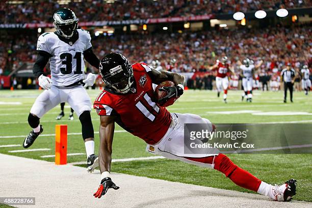 Julio Jones of the Atlanta Falcons scores a touchdown against Byron Maxwell of the Philadelphia Eagles during the first half at the Georgia Dome on...