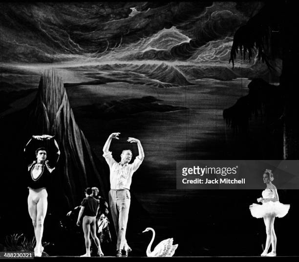 George Balanchine rehearsing Edward Villella and Patricia McBride in Swan Lake, Act II in 1964.