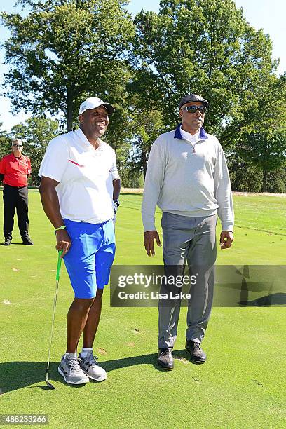 Former baseball player Joe Carter with Julius Erving at the Julius Erving Golf Classic at Aronimink Golf Club on September 14, 2015 in Newtown,...