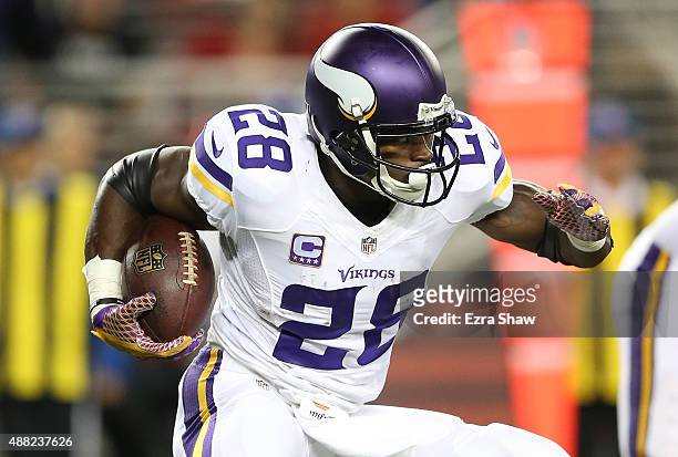 Adrian Peterson of the Minnesota Vikings rushes with the ball against the San Francisco 49ers during their NFL game at Levi's Stadium on September...