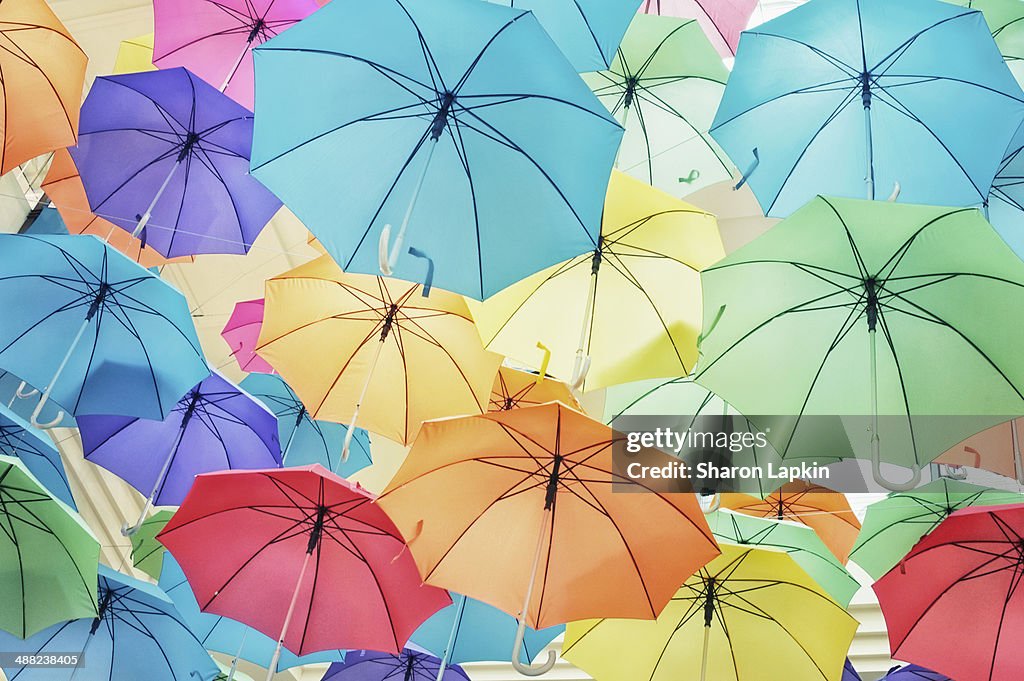Brightly coloured umbrellas in the sky