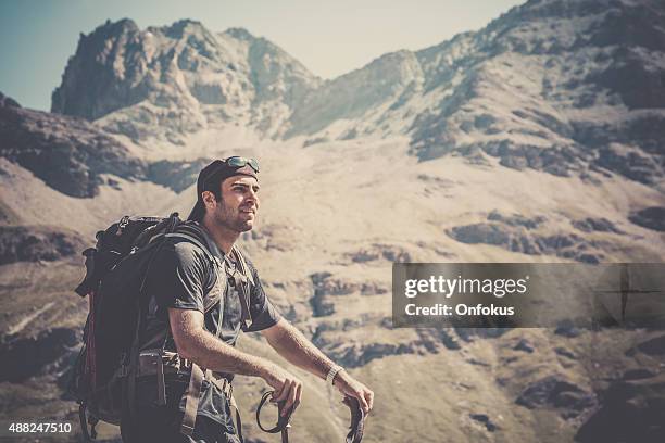 man hiking in the valais canton, switzerland - grande dixence dam stock pictures, royalty-free photos & images