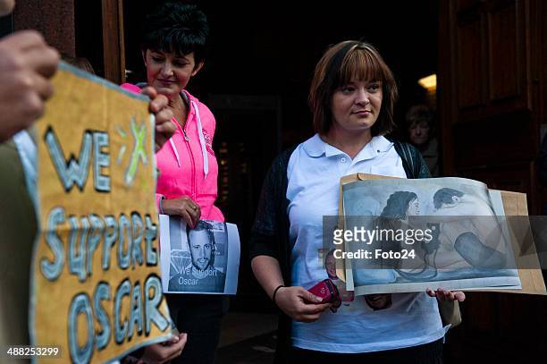 Members of the Support for Oscar Facebook group wait for Oscar Pistorius to arrive at the Pretoria High Court on May 5 in Pretoria, South Africa....