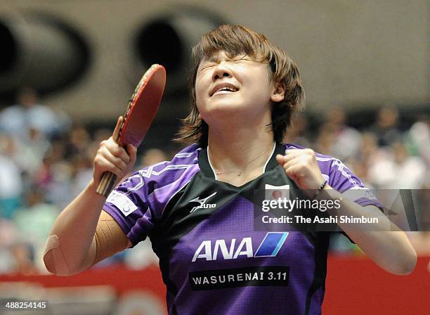 Yuka Ishigaki of Japan celebrates winning the quarter final game against Li Jie of the Netherlands with her teammates during day six of the 2014...