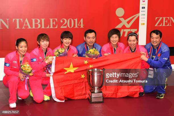 Shiwen Liu, Yuling Zhu, Meng Chen, Coach Linghui Kong, Ning Ding, Xiaoxia Li and team coach of team China pose with gold medal during day eight of...