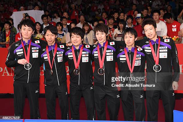 Coach Yosuke Kurashima, Masato Shiono, Seiya Kishikawa, Kenta Matsudaira, Koki Niwa and Jun Mizutani of team Japan pose with bronze medal during day...