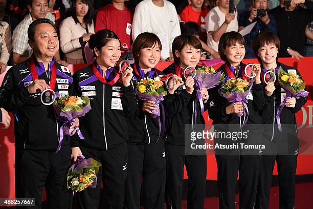 Coach Yasukazu Murakami, Sakura Mori, Saki Tashiro, Yuka Ishigaki, Sayaka Hirano and Kasumi Ishikawa of team Japan pose with silver medal during day...