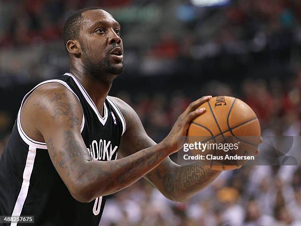 Andray Blatche of the Brooklyn Nets gets set to take a free throw against the Toronto Raptors in Game Seven of the NBA Eastern Conference...