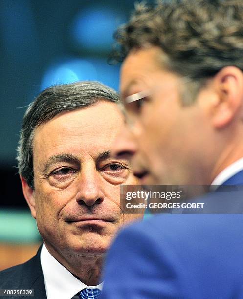 European Central Bank president Mario Draghi and Dutch Finance Minister and Eurozone President Jeroen Dijsselbloem talk prior an Eurozone meeting on...