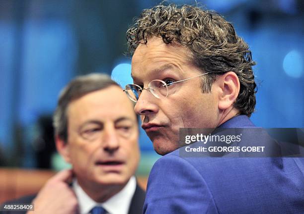 European Central Bank president Mario Draghi and Dutch Finance Minister and Eurozone President Jeroen Dijsselbloem talk prior an Eurozone meeting on...