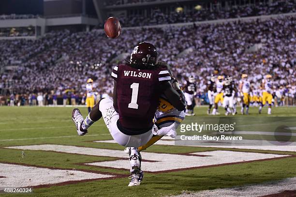 De'Runnya Wilson of the Mississippi State Bulldogs is defended by Tre'Davious White of the LSU Tigers during a game at Davis Wade Stadium on...