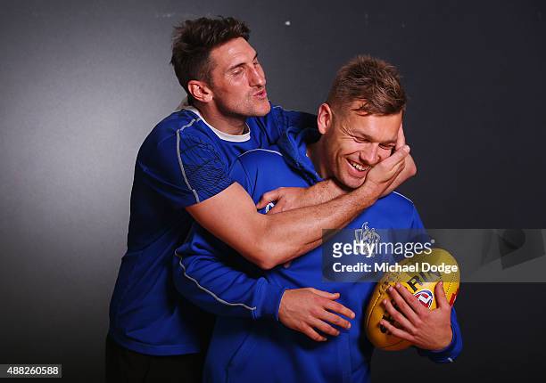 Jarrad Waite attempts to kiss Shaun Higgins while posing during a North Melbourne Kangaroos AFL media session at Arden Street Ground on September 15,...