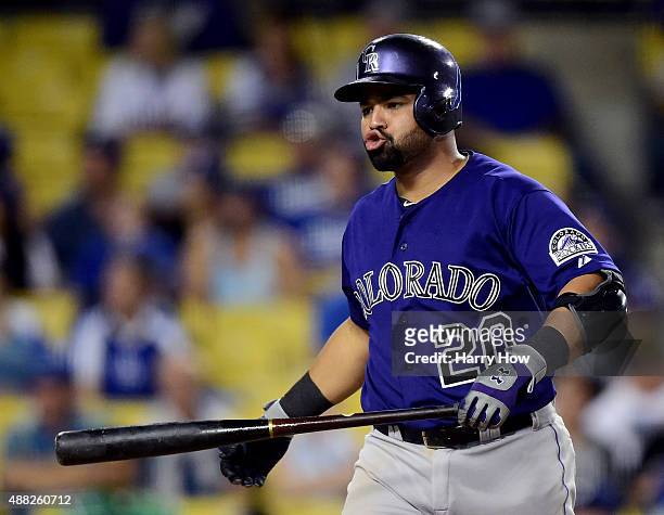 Wilin Rosario of the Colorado Rockies reacts to a strike during the ninth inning against the Los Angeles Dodgers at Dodger Stadium on September 14,...