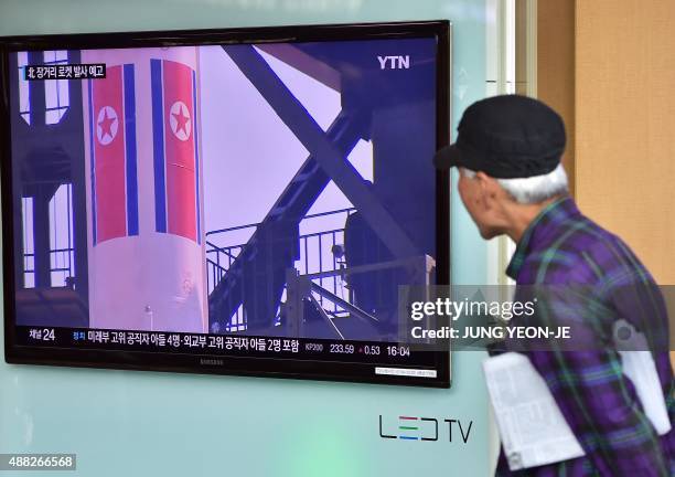 Man watches a news report at a railway station in Seoul on September 15 on the confirmation from North Korea that the nuclear reactor seen as the...
